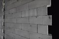 Raw AAC autoclaved aerated concrete wall, angle view, background.