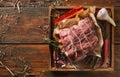 Raw aged prime black angus beef in craft papper on rustic wood Royalty Free Stock Photo