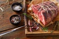 Raw aged prime black angus beef in craft papper on rustic wood Royalty Free Stock Photo