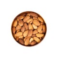 Raw almond nuts in the round wooden bowl isolated on white background. Royalty Free Stock Photo