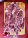 Raw American Angus entrecote beef steak aged on a wooden board. Veal chop.