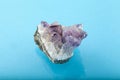 Raw amethyst rock with reflection