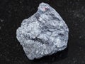 raw antimony ore (Stibnite) stone on dark