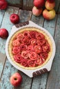 Raw apple rose pie and organic apples on shabby blue table. Home Royalty Free Stock Photo