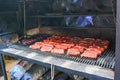 Raw argentine barbecue steaks and blood sausages on typical parrilla argentine barbecue