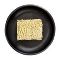 Raw Instant Ramen Noodles in Black Bowl Top View Isolated Royalty Free Stock Photo