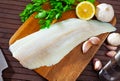 Raw atlantic cod fillet on wooden table Royalty Free Stock Photo