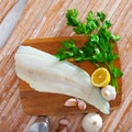 Raw atlantic cod fillet on wooden table Royalty Free Stock Photo