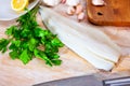 Raw atlantic cod fillet on wooden table Royalty Free Stock Photo