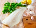 Raw atlantic cod fillet on wooden table Royalty Free Stock Photo