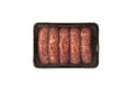 Raw barbecue sausages products in disposable plastic box. Beef frankfurters in package on white background, top view