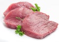 Raw beaf steaks with parsley. Royalty Free Stock Photo