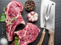 Raw beaf steaks with spices. Royalty Free Stock Photo