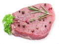 Raw beaf steaks with spices. Royalty Free Stock Photo