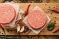 Raw beef burger, traditional barbecue, still life with vegetables and meat Royalty Free Stock Photo