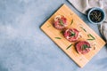 Raw beef filet mignon steak on a wooden board with rosemary and spices, copy space Royalty Free Stock Photo