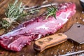 Raw beef meat. Raw beef tenderloin steak on a cutting board with rosemary pepper salt in other positions Royalty Free Stock Photo