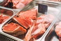 Raw beef and pork in a butcher shop. Best offer of fresh meat at display in supermarket. Butcher shop. Fresh pork at market. Meat Royalty Free Stock Photo