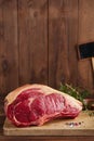 Raw beef Rib bone steak on wooden board and table Royalty Free Stock Photo