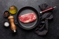 Raw beef ribeye steak on frying pan Royalty Free Stock Photo