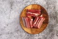 Raw beef ribs on a cutting wooden board on a dark grey background Royalty Free Stock Photo