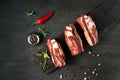 raw beef ribs with spices and herbs on a stone background.top view Royalty Free Stock Photo