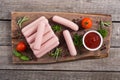 Raw beef sausages with pepper , herbs and ketchup Royalty Free Stock Photo