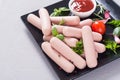 Raw beef sausages with pepper , herbs and ketchup Royalty Free Stock Photo