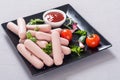 Raw beef sausages with pepper , herbs and ketchup Royalty Free Stock Photo