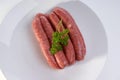 Raw beef sausages on a timber board Royalty Free Stock Photo