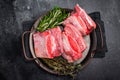 Raw Beef Short Rib, uncooked meat with bone and fat. black background. top view Royalty Free Stock Photo