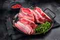 Raw Beef Short Rib, uncooked meat with bone and fat. black background. top view Royalty Free Stock Photo