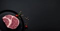 Raw Beef Sirloin Steak with Herbs on Black Background, Copy Space