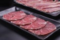 Raw beef slice for barbecue japanese style, yakiniku, meat are being cooked on stove Royalty Free Stock Photo