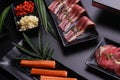 Raw beef slice for barbecue japanese style, yakiniku, meat are being cooked on stove Royalty Free Stock Photo