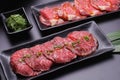 Raw beef slice for barbecue japanese style, yakiniku, meat are being cooked on stove Royalty Free Stock Photo