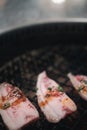 Raw beef slice for barbecue over charcoal on stove in restaurant, Japanese food