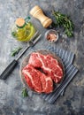 Raw beef steak on dark gray background Royalty Free Stock Photo