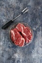 Raw beef steak on dark gray background Royalty Free Stock Photo