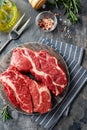 Raw beef steak on dark gray background Royalty Free Stock Photo