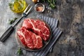 Raw beef steak on dark gray background Royalty Free Stock Photo