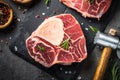 Raw beef steak osso bucco on black. Marble meat. Royalty Free Stock Photo