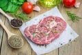 Raw beef steak with seasoning Royalty Free Stock Photo