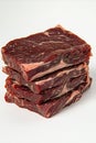 Raw Beef Steaks Stacked, Studio Shot on White Background Royalty Free Stock Photo