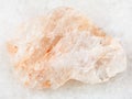raw belomorite stone on white marble Royalty Free Stock Photo