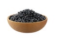 Raw black beans in a wooden bowl isolated on white background Royalty Free Stock Photo