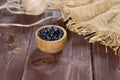 Raw black turtle beans on brown wood Royalty Free Stock Photo