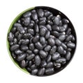 Raw black turtle beans in round bowl isolated