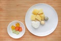 Raw of boiled vegetables baby food egg, potato and rice in white plate with frozen mashed baby food homemade in white ceramic Royalty Free Stock Photo