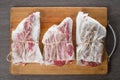 Raw Bone-in Rib eye Steak on wooden background Royalty Free Stock Photo